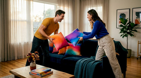 Couple arranging pillows in cozy modern living room